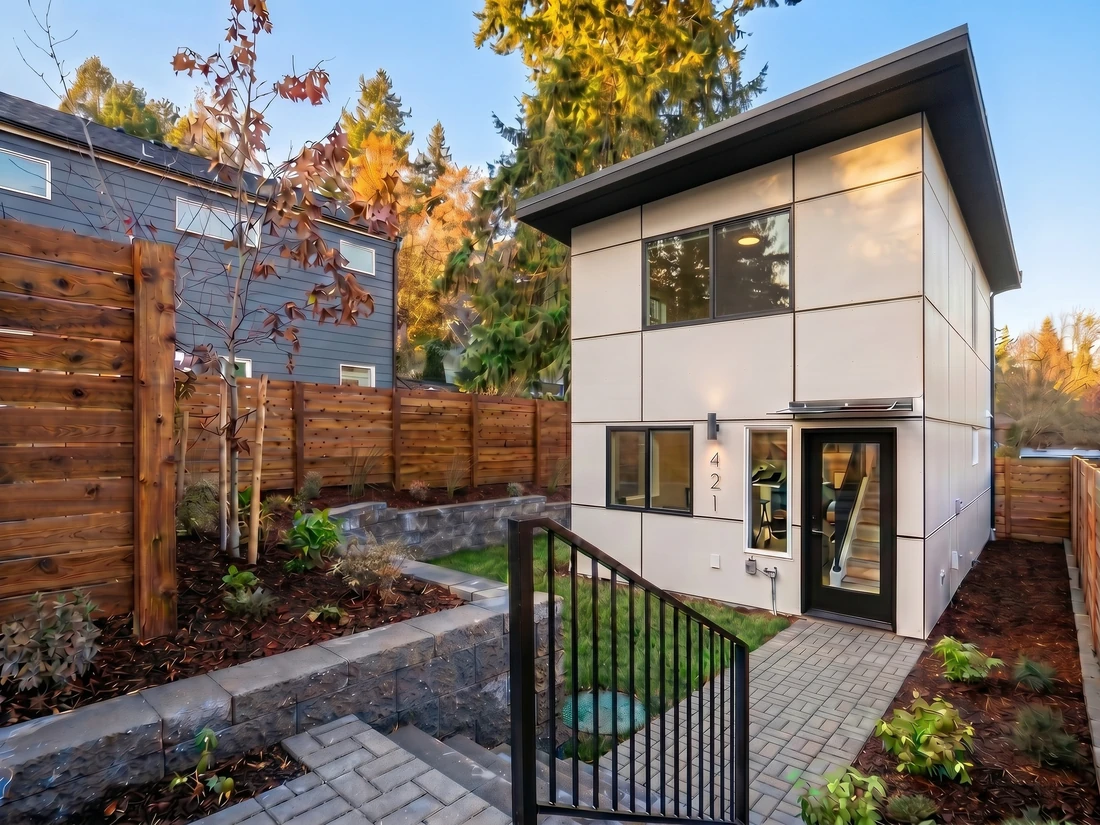 Modern home with a backyard DADU, the kind MNBE builds in Seattle