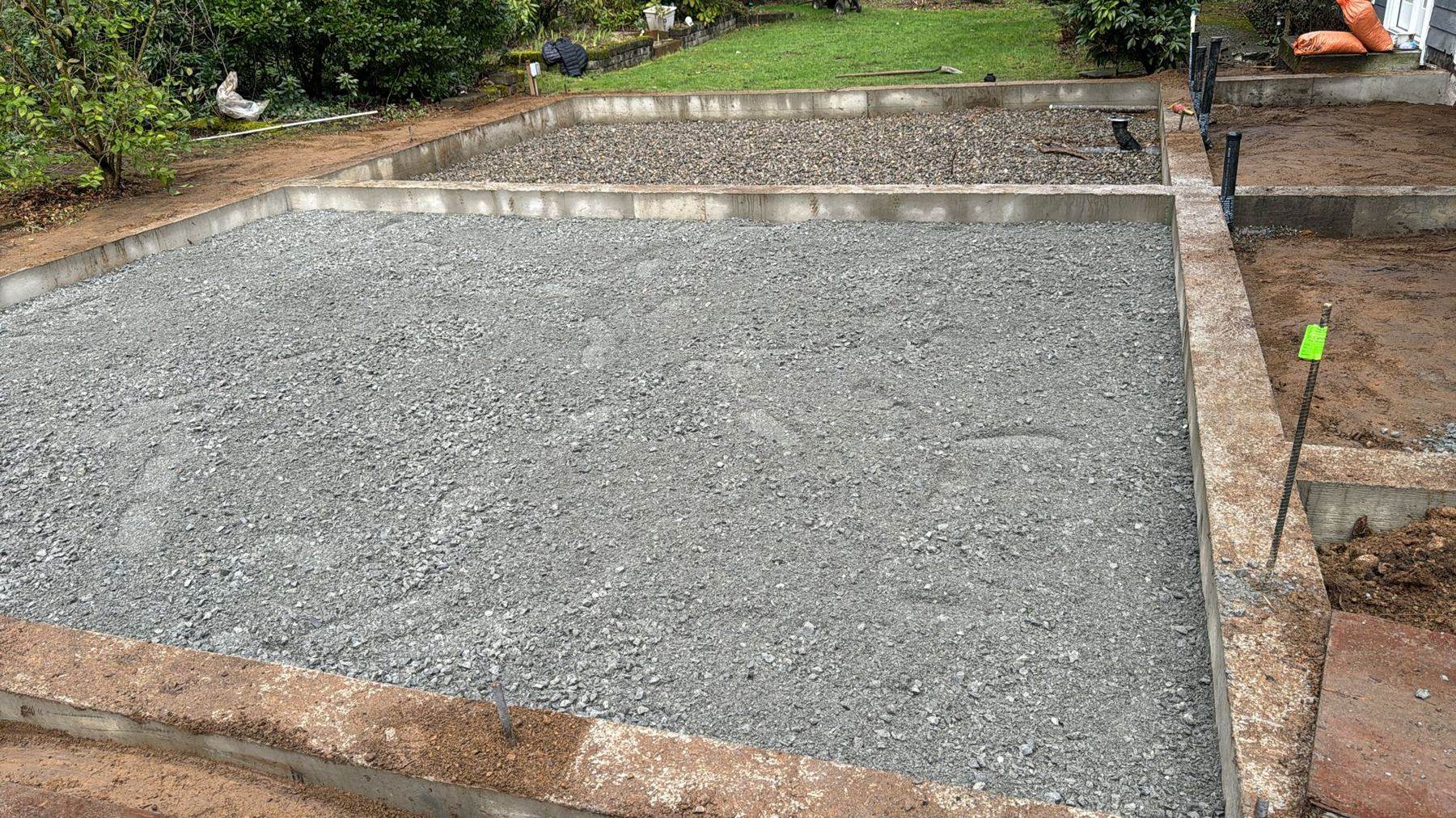 Foundation walls poured and gravel pad