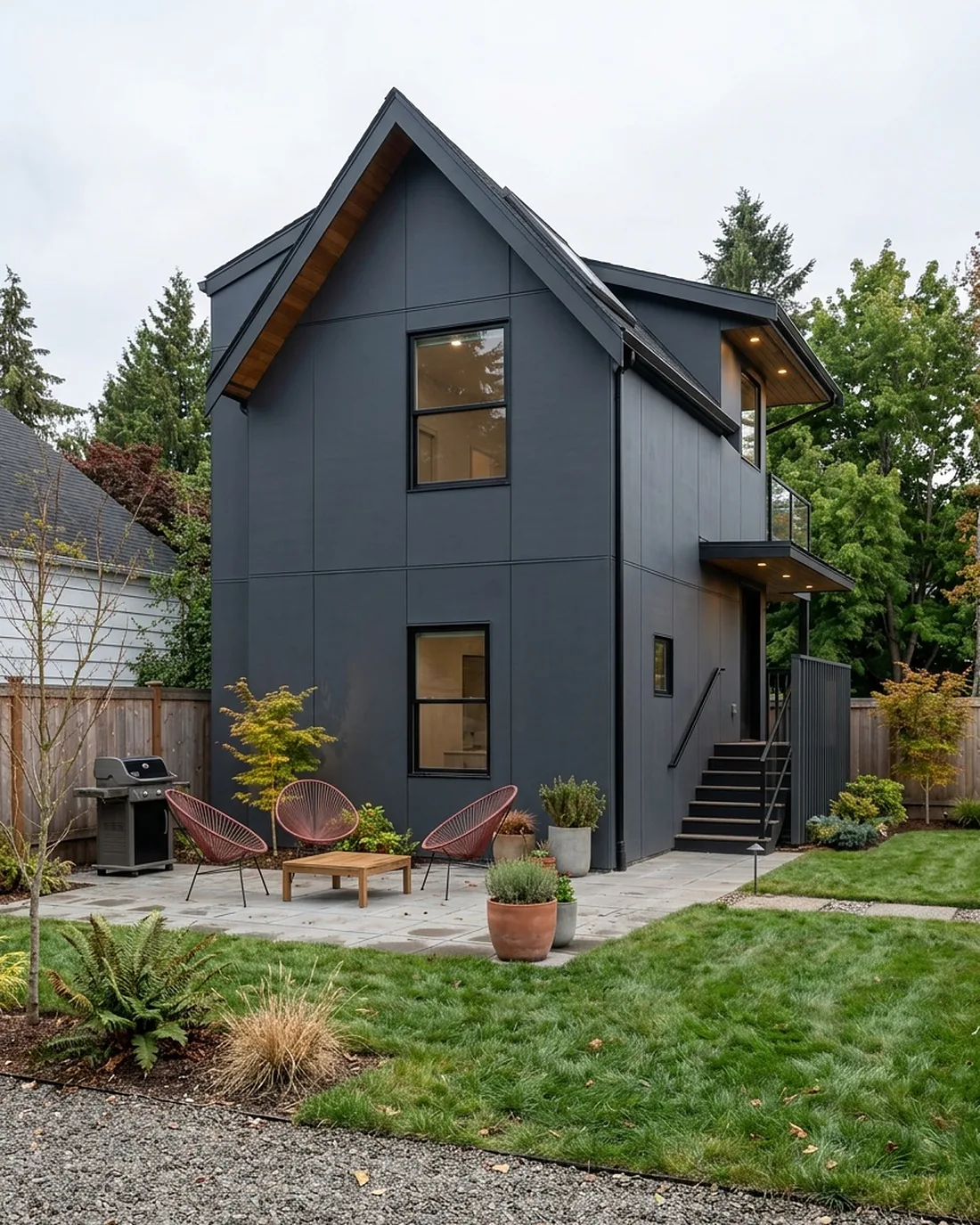 Modern single-story ADU with warm cedar siding and glass, the kind MNBE designs and builds across Mercer Island