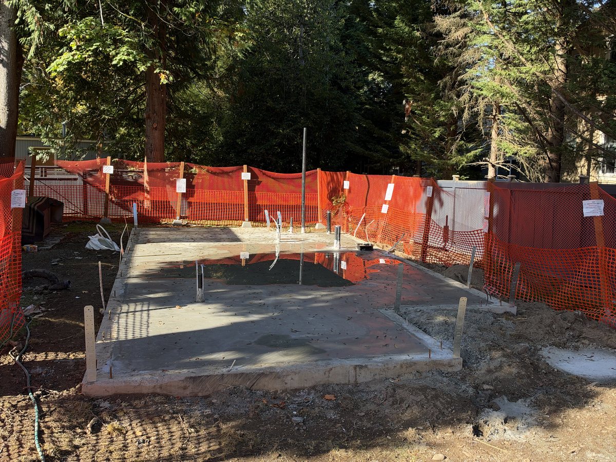 Fresh concrete slab with plumbing stubs