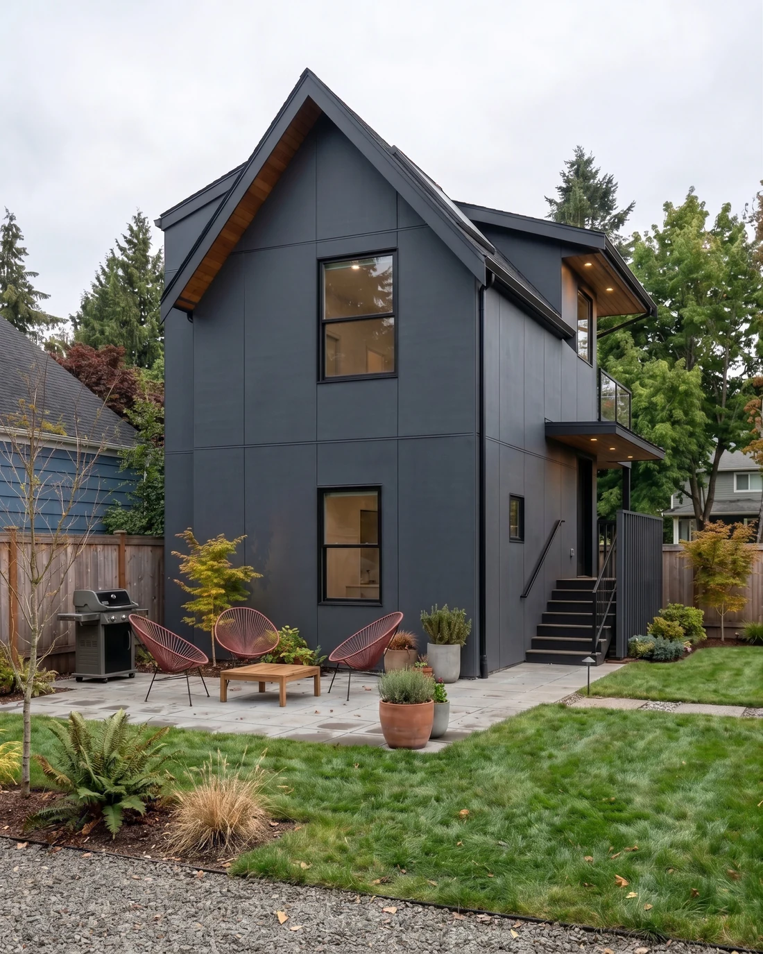 Modern single-story ADU with warm cedar siding and glass, the kind MNBE designs and builds across Mercer Island