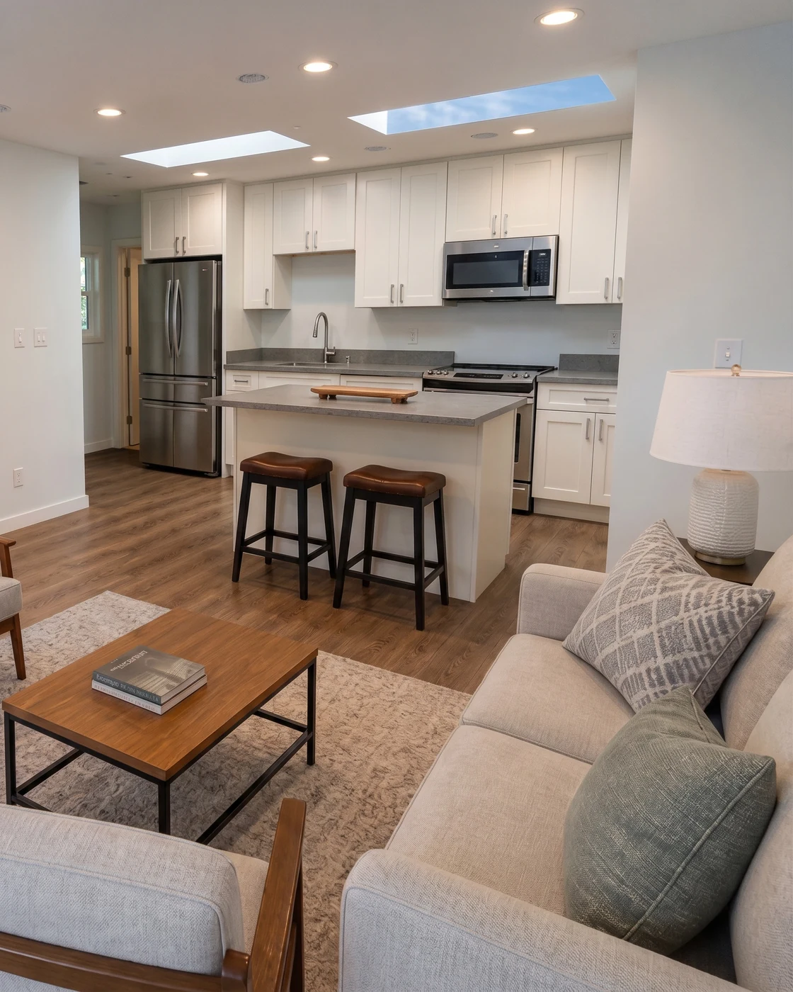 Finished lower level living space with warm wood floors, the kind of space a basement ADU conversion by MNBE delivers