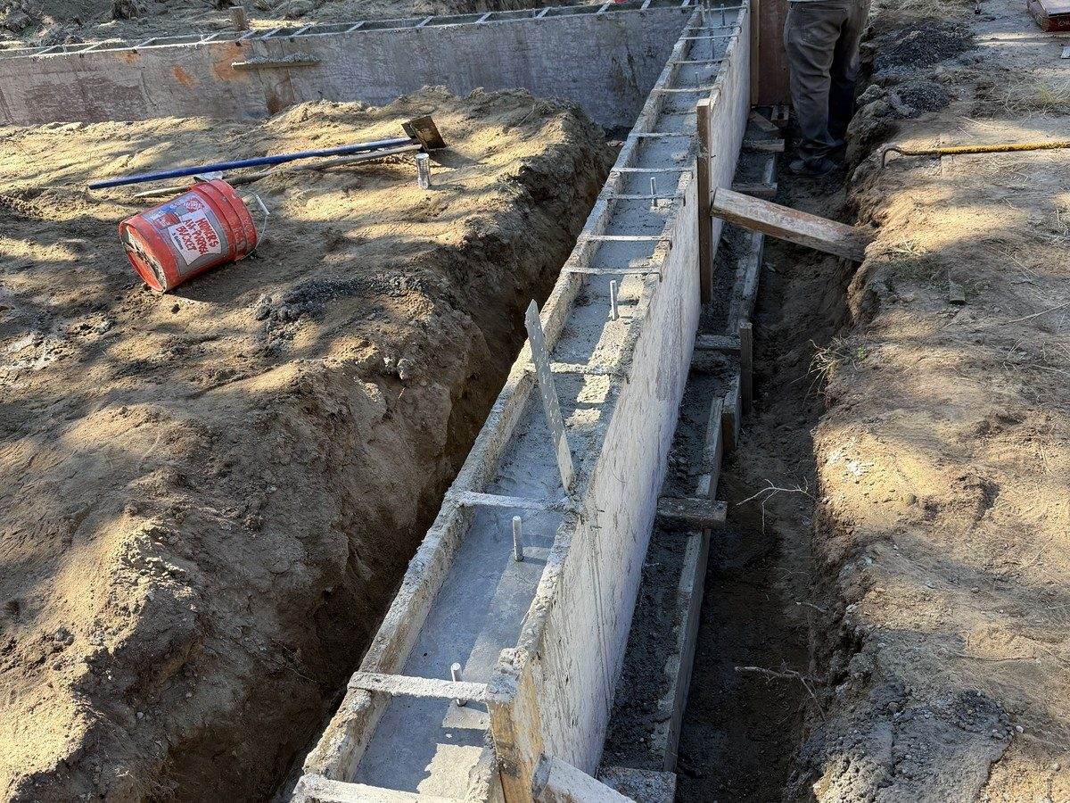 Cured stem walls in forms along the trench