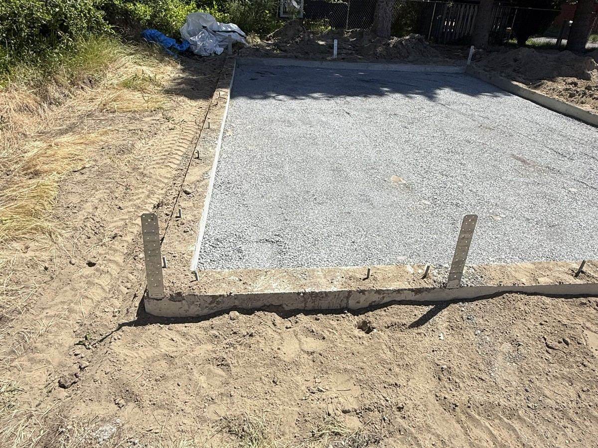 Compacted gravel base inside the foundation