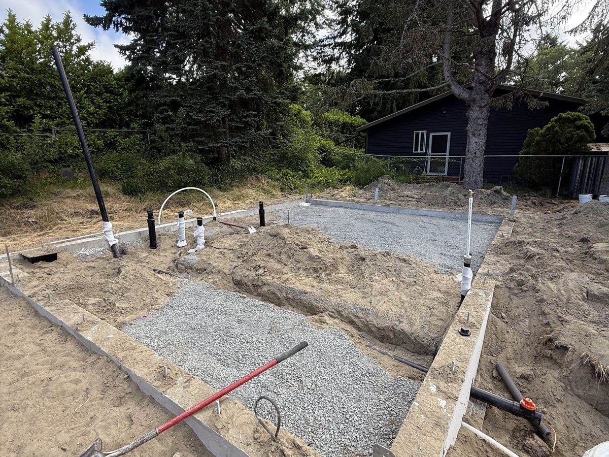 Plumbing stub-ups through the gravel base