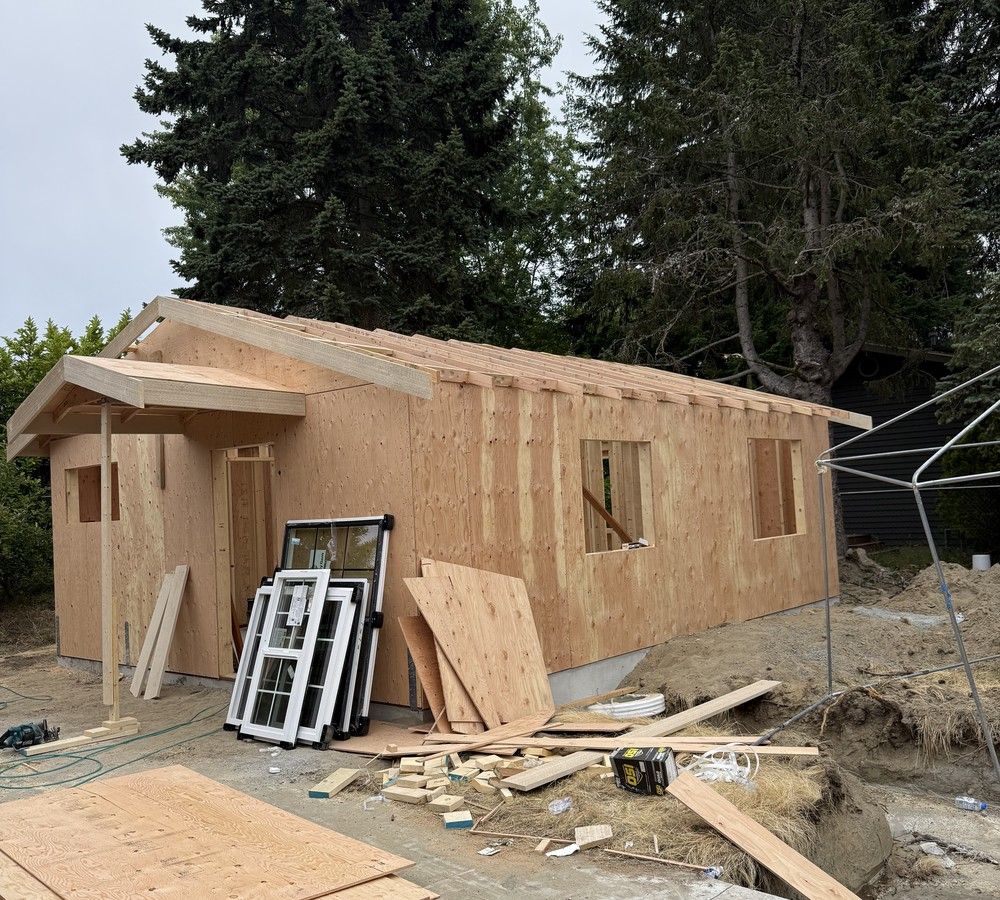 Sheathed ADU with new windows staged on site